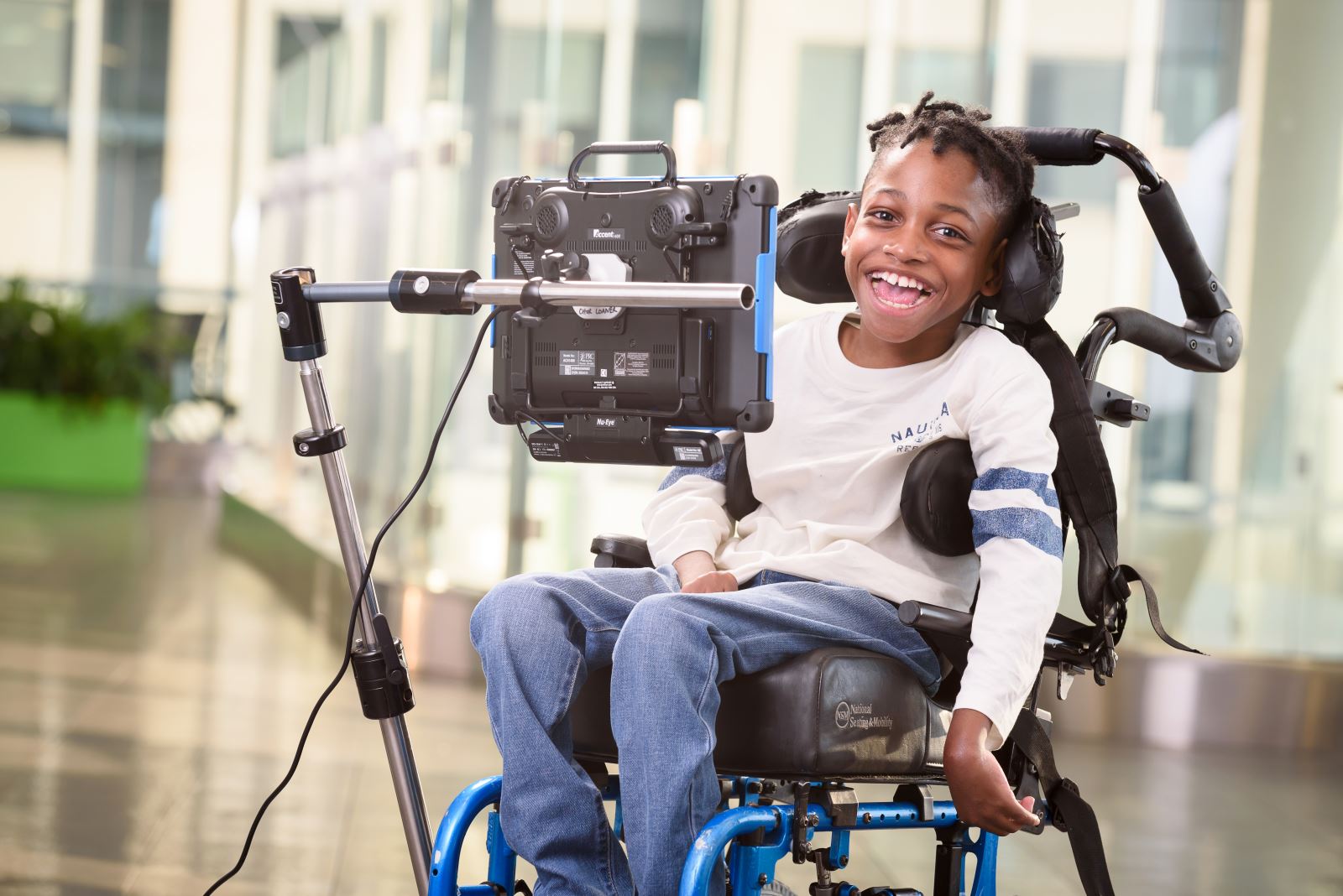 Young boy in assistive chair