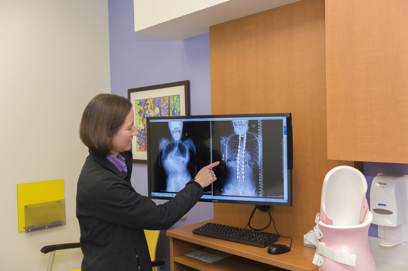 orthopaedic therapist looks at spine on x-ray