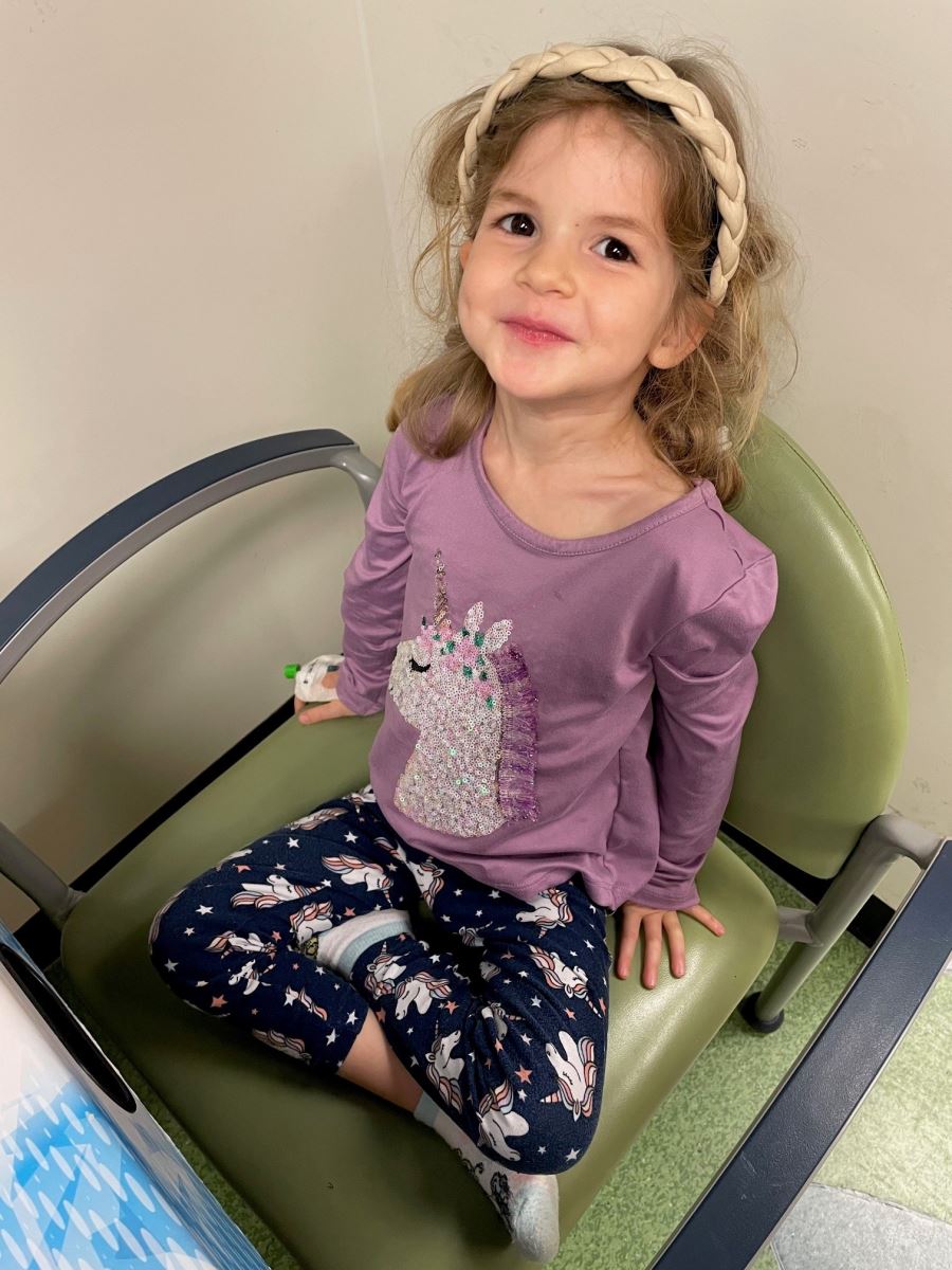 CHoR patient Madison sitting in a chair