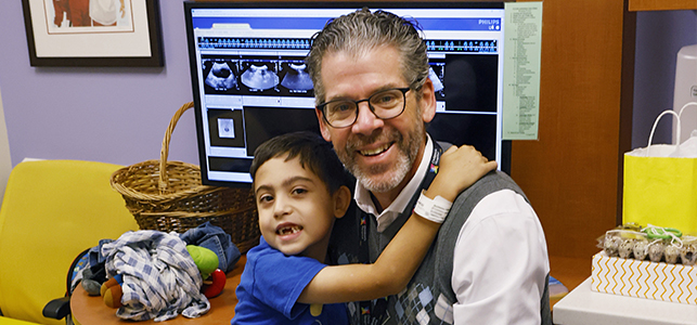 Boy and doctor hugging