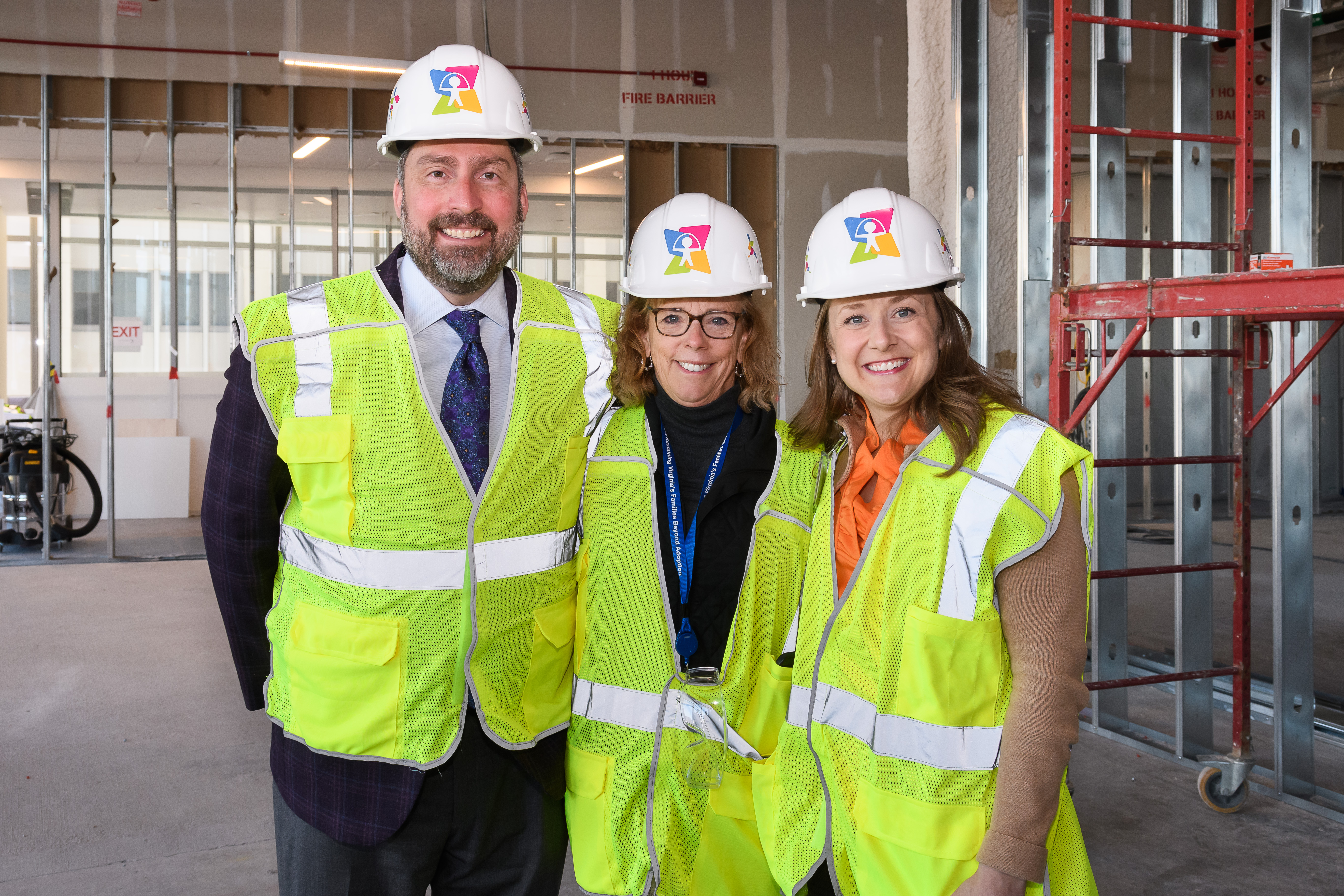 Three CHoR leaders with construction safety gear on.