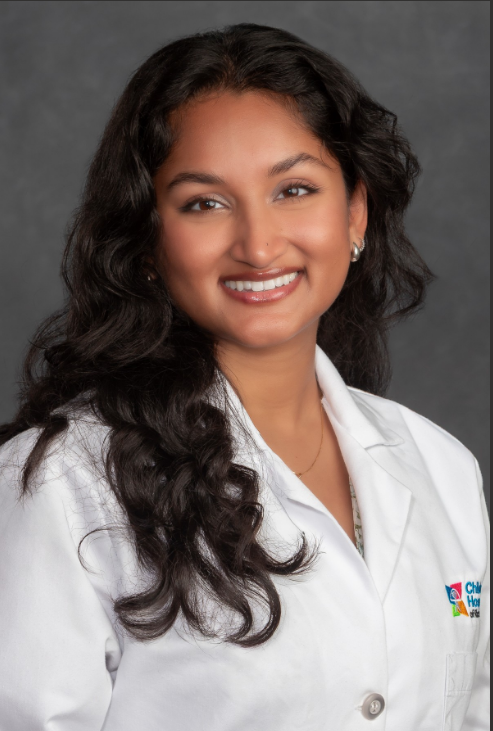 Headshot of Shrina Patel wearing a white physician's coat